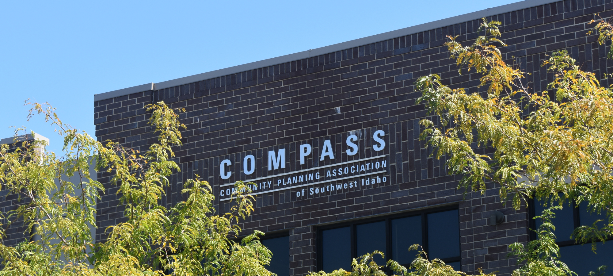COMPASS - The Community Planning Assocation of Southwest Idaho's Building with green trees